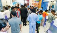 Trust Exchange Company officials and its customers at Regency Shopping Complex in Umm Salal Ali. 
