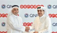 QNB and Ooredoo officials during agreement signing ceremony.