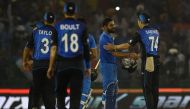 India's Virat Kohli (C) is congratulated by members of the New Zealand cricket team after India won the third one day international (ODI) match between Indian and New Zealand at The Punjab Cricket Stadium Association Stadium in Mohali on October 23, 2016.