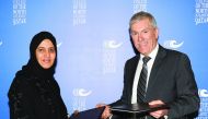 Secretary-General of Qatar National Commission for Education Culture and Science, Dr Hamda Hassan Al Sulaiti (left), and President of College of North Atlantic-Qatar (CNA-Q), Dr Ken MacLeod, exchanging documents after signing the deal yesterday.  (Pic: Sa