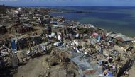 (FILES) This file photo taken on October 10, 2016 shows an aerial views of Jeremie, 188 km west of Port-au-Prince, following the passage of Hurricane Matthew. On a football field in the Haitian town of Jeremie, children gather to gape at a drone preparing