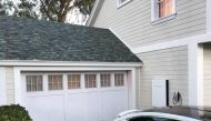 Tesla's electric car, Powerwall and solar roof are shown by Tesla Motors Inc Chief Executive Elon Musk, unveiling new energy products aimed at illustrating the benefits of combining his electric car and battery maker with solar installer SolarCity Corp, i