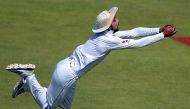 Pakistani cricketer Mohammad Amir takes a catch of West Indies' batsman Darren Bravo (unseen) on the second day of the third and final Test between Pakistan and West Indies at the Sharjah Cricket Stadium in Sharjah on October 31, 2016. (AFP / Aamir QURESH