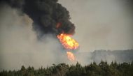 Flames shoot into the sky from a gas line explosion in western Shelby County, Alabama, U.S., October 31, 2016. Reuters/Marvin Gentry