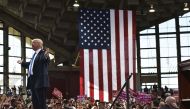 Republican presidential nominee Donald Trump arrives for a rally at the J.S. Dorton Arena in Raleigh, North Carolina on November 7, 2016. Hillary Clinton and Donald Trump battled for votes on a frenzied final day of campaigning Monday, telling Americans t