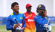Sri Lanka batsman Dhananjaya De Silva (L) and teammate Kusal Mendis (R) walk off the pitch after their victory in the opening match of the ODI series Sri Lanka vs Zimbabwe on November 14, 2016 in Harare. (AFP / Jekesai Njikizana)