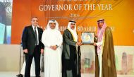 QCB Governor H E Sheikh Abdullah bin Saud Al Thani  (second right) receiving 'Governor of the Year 2016' award from Union of Arab banks (UAB) Chairman Sheikh Mmohammed Jarrah Al-Sabah, (right)  as UAB Board member Ali Ahmed Al Kuwari (second left) and Wis