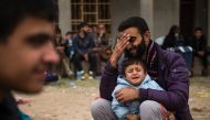  Iraqis fleeing the fighting rest as they reach an area held by Iraqi Special Forces 2nd division for transport out of the combat zone in the Samah neighbourhood of Mosul on November 15, 2016. Hundreds of people used the opportunity to try and get out of 