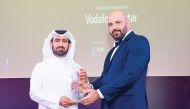 Mohammed Al Yami (left), Director of External Affairs, Vodafone Qatar, receiving the award. 