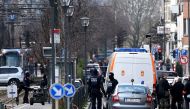 FILE PHOTO: Police stand next to a bomb squad robot during an demining operation at a tramway station on March 25, 2016 in Schaerbeek suburb, Brussels, during a bomb alert. (AFP / PATRIK STOLLARZ)