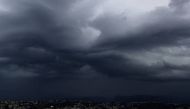 An approaching storm looms over the French riviera city of Nice, southeastern France, on September 21, 2016. / AFP PHOTO / VALERY HACHE