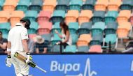 Australia's captain Steven Smith walks off the field with his heads down following his dismissal off South Africa's paceman Kagiso Rabada on the fourth day's play of the second Test cricket match between Australia and South Africa in Hobart on November 15