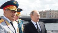 Russian President Vladimir Putin (R) and Defence Minister Sergei Shoigu (L), pictured in July. / AFP.