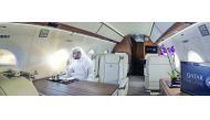 A guest of Qatar Executive enjoying a sip of coffee inside the Gulfstream G650ER’s cabin  equippped with the most advanced technology, including satellite communications.