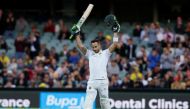 South Africa's captain Faf du Plessis celebrates his century 100 runs during the first day of the Third Test cricket match in Adelaide. (Reuters/Jason Reed)