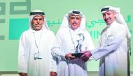 A Qatalum official receiving the award.