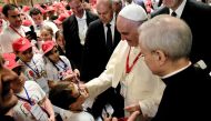 Pope Francis greets a boy as he meets some 400 children who came from Calabria to meet him,Vatican City May 28, 2016 (EPA / VINCENZO PINTO) 