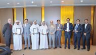 Doha Bank CEO Dr R Seetharaman ( sixth left) and otehr officials with the awards