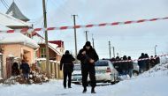 An armed policeman guards as the police experts examine crime scene in the small town of Knyazychy, some 30 kilometres east of Kiev, on December 4, 2016.
Five Ukrainian police were killed by friendly fire on December 4, 2016 in a deadly accident at a cri