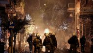 Fireworks explode next to riot police during clashes following an anniversary rally marking the 2008 police shooting of 15-year-old student, Alexandros Grigoropoulos, in Athens, Greece, December 6, 2016. REUTERS/Alkis Konstantinidis TPX IMAGES OF THE DAY