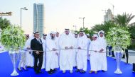 H E Sheikh Ahmed bin Jassim Al Thani, Minister of Economy an Commerce, cutting the ceremonial ribbon to mark the opening of Qatar International Boat Show, yesterday.