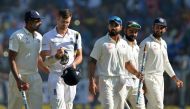 India's Ravichandran Ashwin (L) speaks with England's James Anderson (2nd L) as India's Murali Vijay (C), captain Virat Kohli (2nd R) and Cheteshwar Pujara (R) watch after India won the fourth Test cricket match against England at the Wankhede stadium in 