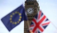 Participants hold a British Union flag and an EU flag during a pro-EU referendum event at Parliament Square in London, Britain June 19, 2016. REUTERS/Neil Hall/File Photo
