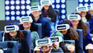 People test virtual reality Samsung Gear VR glasses at the Grand Palais exhibition hall as part of Christmas holiday season animations in Paris.