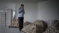 Samir Constantini, chief executive officer and founder of Aleppo soap company Alepia, smells a bar of soap in Santeny, 30kms from Paris, on December 19, 2016. AFP / PHILIPPE LOPEZ
