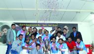 Champion Tuskers pose for a photograph with the trophy and tournament officials. 