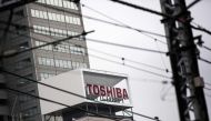 The logo of Toshiba Corporation is displayed at the company's headquarters in Tokyo on December 27, 2016. AFP / Behrouz MEHRI
