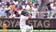 Pakistan batsman Azhar Ali drives a delivery on the way to scoring his double century against Australia on the third day of the second cricket Test match in Melbourne on December 28, 2016. AFP / WILLIAM WEST