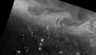 The northern lights — the swirling, cloud-like features in this image — stretched across northern Canada during the nighttime hours of Dec. 22, 2016. Jesse Allen / NASA Earth Observatory
