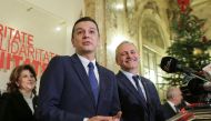Sorin Grindeanu (C) gestures while answering a question during a press conference held alongside Romania's Social Democrat party (PSD) leader, Liviu Dragnea (R), in Bucharest, Romania December 28, 2016. Inquam Photos/Octav Ganea/via REUTERS 