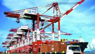 A truck transports containers at a port in Qingdao, eastern China’s Shandong province.