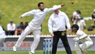 Bangladesh's Shakib Al Hasan (L) fields the ball watched by New Zealand's BJ Watling during day four of the first international Test cricket match between New Zealand and Bangladesh at the Basin Reserve in Wellington on January 15, 2017. (AFP / Marty Melv