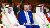 Deputy Prime Minister and Minister of State for Cabinet Affairs H E Ahmed bin Abdullah bin Zaid Al Mahmoud (right), Sheikh Dr Khalid bin Thani bin Abdullah Al Thani (first left), Chairman and Managing Director, QIIB and other officilas at the Qatar Chambe