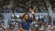 France's Jo-Wilfried Tsonga waves after winning his Men's singles fourth round match against Britain's Daniel Evans. (REUTERS/Edgar Su)