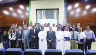 Officials of Oryx GTL pose for a group picture after the award ceremony at company's headquarters.