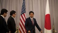 FILE PHOTO: Japan Prime Minister Shinzo Abe arrives to speak to reporters following a meeting with President-elect Donald Trump, November 17, 2016 in New York City (Drew Angerer / Getty Images / AFP) 
