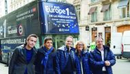(LtoR) French journalists Nicolas Escoulan, Thomas Sotto, Fabien Namias, Isabelle Millet, and Nicolas Poincare pose for a picture during the launch of radio Europe 1's 'presidential bus' in Paris on February 3, 2017. AFP / Christophe Archambault