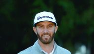 Dustin Johnson poses with the Genesis Open trophy in Pacific Palisades, California on Sunday.