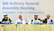Sheikh Jassim bin Hamad bin Jassim bin Jaber Al Thani (second right), Chairman of QIB, and Abdullatif bin Abdullah Al Mahmoud (second left), Vice-Chairman of QIB with other board members at the Bank's Ordinary General Assembly meeting held at the Four Sea
