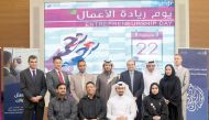 Commercial Bank officials, exclusive sponsor of  Qatar University's 'Entrepreneurship Day', pose for a group photo.