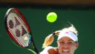 Angelique Kerber of Germany plays a backhand shot against Pauline Parmentier of France in their third round match during day eight of the BNP Paribas Open at Indian Wells Tennis Garden on Monday. 