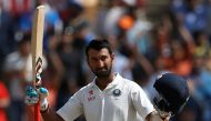 India's Cheteshwar Pujara celebrates his century. (REUTERS/Adnan Abidi)