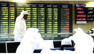 Traders seen at Qatar Stock Exchange in the file picture. 