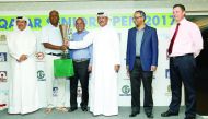 Fahad Nasser Al Naimi, the Secretary General of Qatar Golf Association (QGA) and Mohammed Faisal Al Naimi, the QGA Executive Director giving away the winner's trophy to Nasser Yacoob of Bahrain at the Qatar Senior Open Golf Championship 2017 at the Doha G