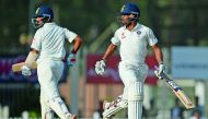 India's Wriddhiman Saha (right) and Cheteshwar Pujara run between the wickets during the third Test cricket match against Australia  at JSCA Stadium  Complex in Ranchi in this  March 18  file photo. 