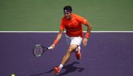 Milos Raonic of Canada in action against Viktor Troicki of Serbia at Crandon Park Tennis Center on March 24, 2017 in Key Biscayne, Florida. Julian Finney/Getty Images/AFP
